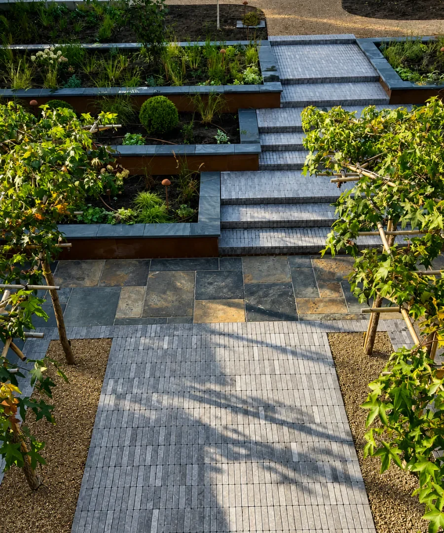 Back garden tiling with pergola, porcelain paving and raised planting beds