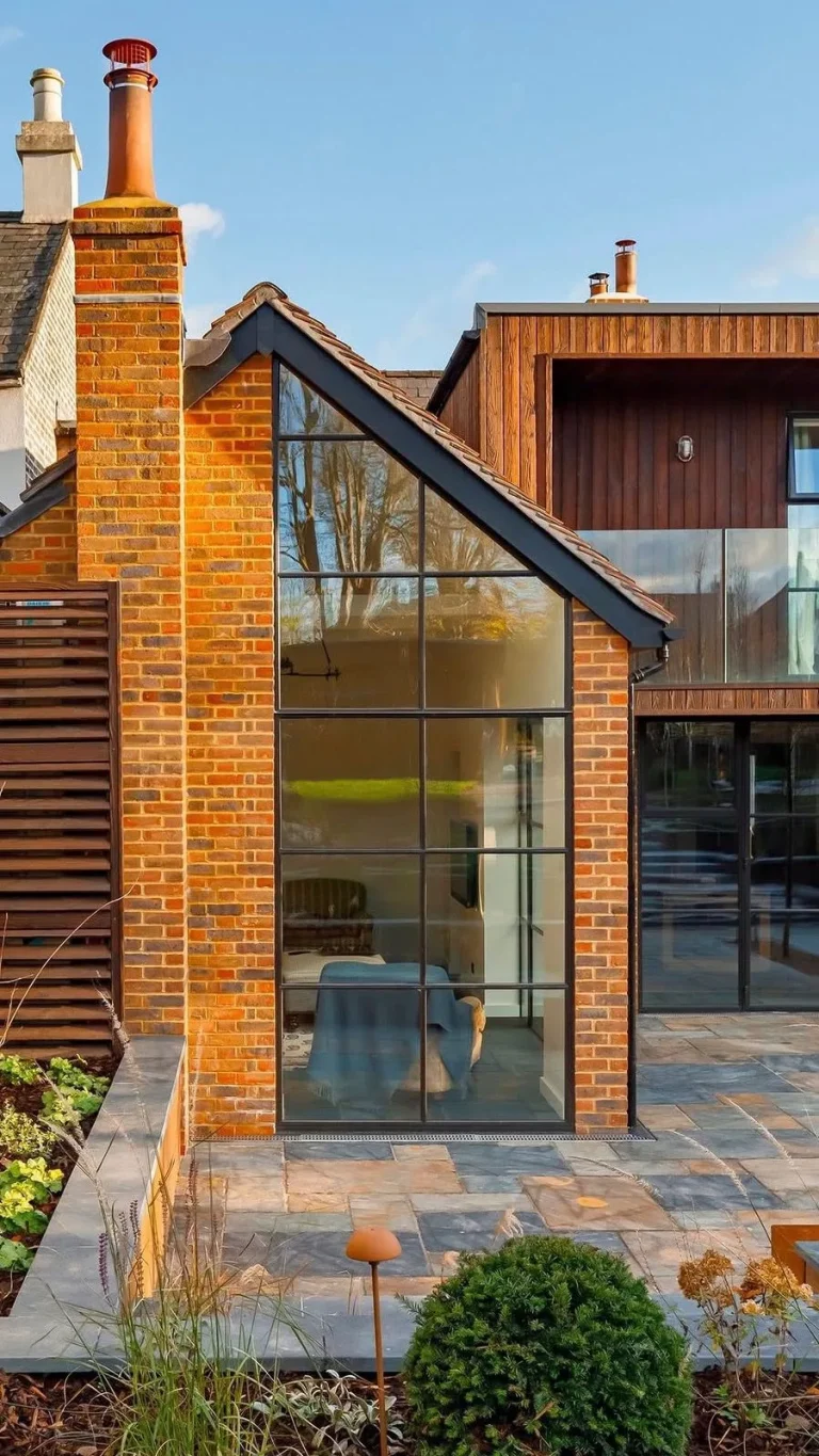 Rear house extension overlooking the transformed Surrey garden patio