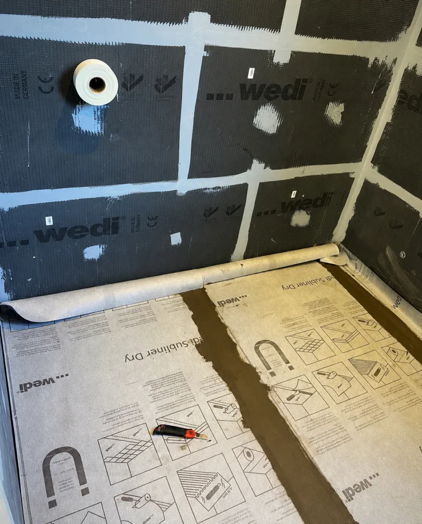 Waterproofed shower wall and floor before tiling